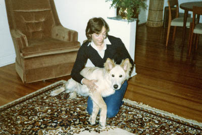 Pupper is lying on his mommy's lap. He started his mommy's education about dogs.