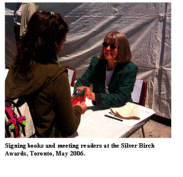 Text Box:  
Signing books and meeting readers at the Silver Birch Awards, Toronto, May 2006.
